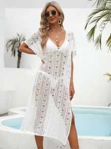 Elegant white hollow crochet beach cover up dress with deep V-neck for summer resort