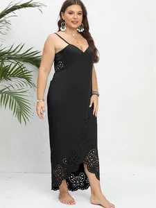 Plus size black wrap beach dress with laser-cut eyelet floral details and irregular hem