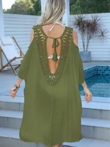 Back view of a chic olive green crochet backless beach cover-up dress for women