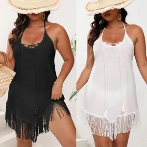 Comparison of black and white fringe beach cover-ups with strappy backless design.