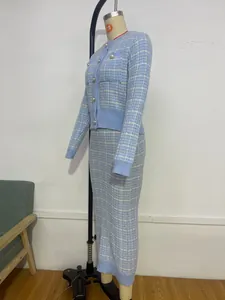 Detailed side view of light blue plaid knit cardigan and bodycon skirt set on mannequin.
