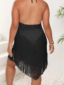 Plus size black beach cover-up featuring fringe hem and sexy halter backless design
