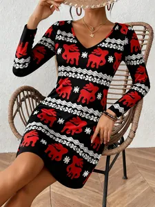 Detail view of long sleeve V-neck Christmas dress with red reindeer and snowflake print