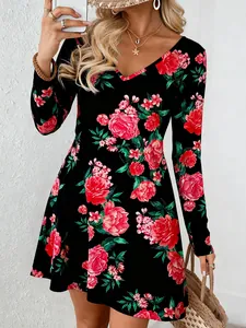 Close-up detail of women's V-neck A-line dress with red floral print for Christmas