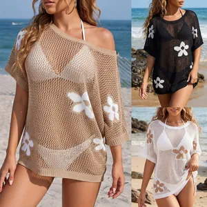 Detailed view of floral crochet beach cover-up available in multiple colors.