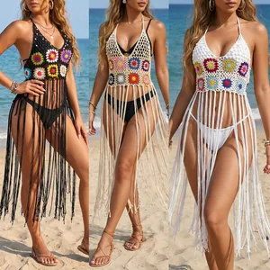Hand-crocheted bohemian beach bikini cover-up with colorful floral motifs and long tassels