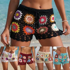 Detailed view of hand-crocheted granny square beach shorts for women in five colors