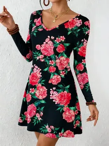 Detailed view of women's floral A-line dress with V-neck and long sleeves