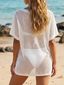 Back view of white crochet beach cover-up with short sleeves and hollow out net texture