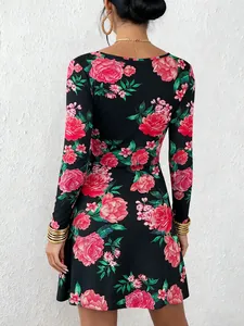 Back view of a black long-sleeve A-line dress with vibrant red floral print