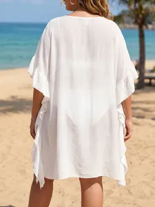 Detailed back view of white ruffled plus size beach cover-up with a loose oversized fit