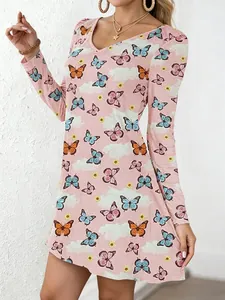 Detail view of women's V-neck A-line dress featuring vibrant butterfly and cloud print.