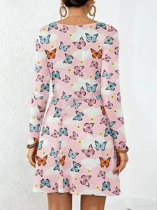 Back view of pink long-sleeved A-line dress featuring colorful butterfly and cloud prints