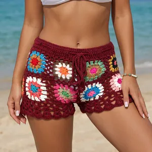 Detailed view of handmade crochet beach shorts with colorful granny square patterns