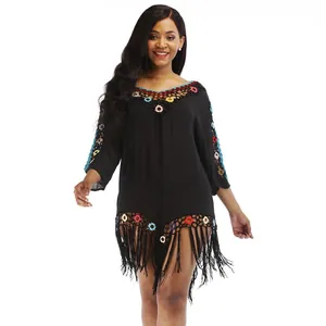 Bohemian black beach cover-up dress with colorful crochet details and fringe tassels