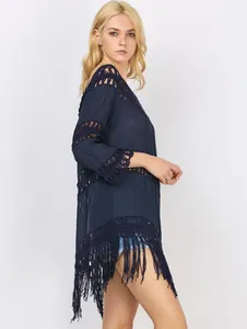Detailed side view of navy blue crochet tassel bikini cover up with stylish fringe