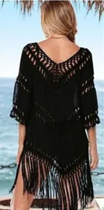 Back view of black crochet beach cover-up with hollow knit and fringe detail