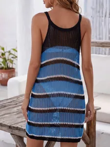 Close-up of a hollow knit striped beach dress cover-up in blue, black, and white.