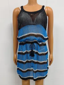 Close-up of hollow-out knit beach dress with striped color-block design and tassel