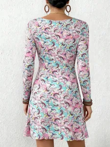 Back view of a vibrant colorful paisley print A-line long sleeve mini dress for women