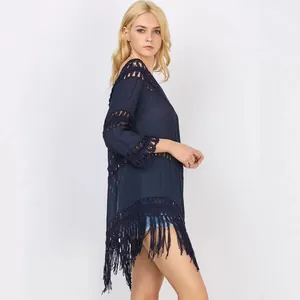 Navy blue bohemian crochet tassel bikini cover-up tunic dress shown from a side view