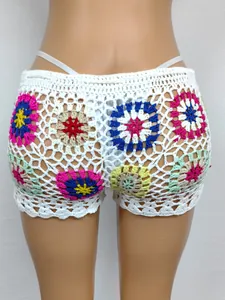 Detailed back view of colorful handmade crochet granny square patch beach hot pants