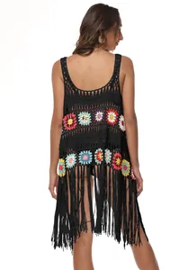 Detailed back view of Boho black crochet beach cover-up with colorful flowers and long fringes