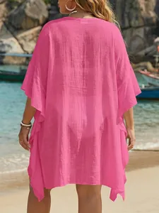 Back view of a vibrant pink plus size ruffle beach cover-up cardigan for women