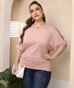 Detail of pink plus size t-shirt with pleated hem and cold shoulder design on model