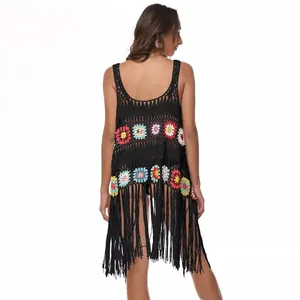 Bohemian black crochet beach cover-up with colorful floral motifs and long tassels