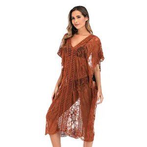 Vista detallada del vestido playero de encaje marrón transparente para mujer