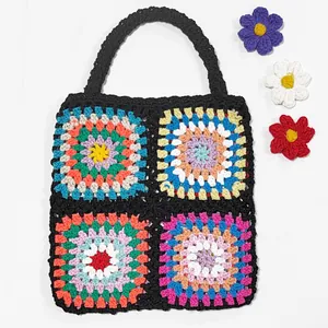Handmade crochet granny square handbag with folk style colorful patchwork design