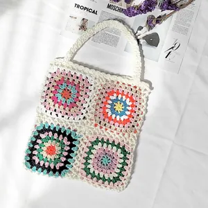 Hand-crocheted granny square tote bag with colorful bohemian patchwork design.