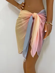 Detail of tie-dye gradient mesh beach sarong wrap skirt on mannequin