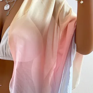 Close-up detail of gradient sheer chiffon fabric texture for women's beach wrap scarf