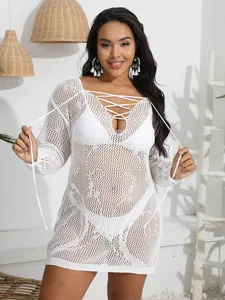 Detail view of plus size white crochet mesh cover-up dress with lace-up V-neckline