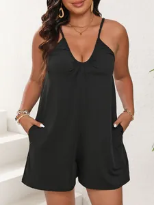 Detailed view of plus size black jumpsuit with sexy deep V-neck and casual side pockets