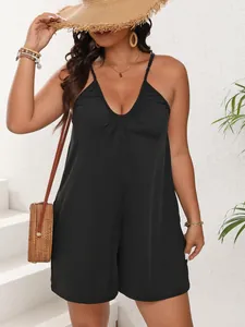 Detail view of a stylish black plus size deep V-neck romper with spaghetti straps.