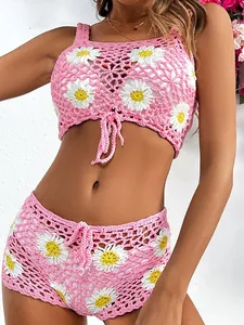 Handmade pink daisy crochet two-piece set with camisole crop top and matching shorts