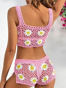 Two-piece pink crochet daisy bikini set with crop top and shorts summer beachwear