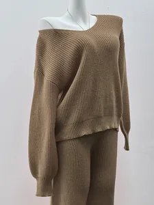 Detailed view of brown knitted two-piece set on a mannequin showing ribbed texture