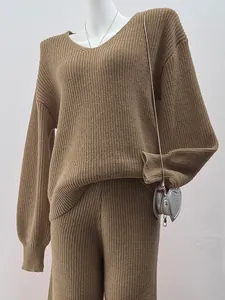 Detailed view of a brown V-neck knitted sweater and matching pants set for women