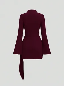 Back view of a textured burgundy knit long sleeve mini dress with bell sleeves