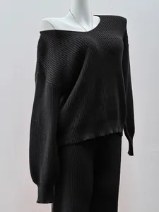 Casual black V-neck knit sweater and matching long pants two-piece set on a mannequin