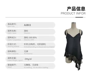 Detail view of a black V-neck camisole featuring irregular lace trim at the hem.