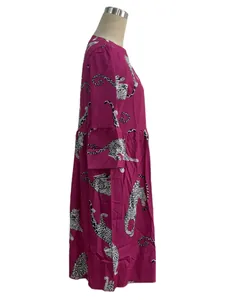 Detail view showing the side profile of a fuchsia leopard print dress with ruffled bell sleeves