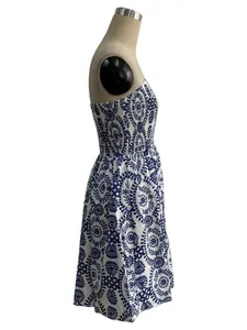 Side detail of women's blue floral print tube top dress with smocked bodice on mannequin