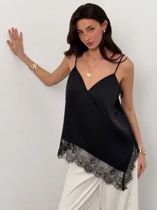 Detail view of a black V-neck satin camisole with an irregular lace trim hem