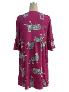Detailed back view of a stylish fuchsia dress with white and black leopard pattern prints