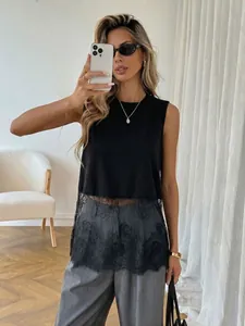 Detail view of the delicate floral lace hem on this black sleeveless tank top for women.